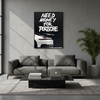Need Money for Porsche framed poster displayed above a gray sofa in a modern living room with natural light and minimalist decor.