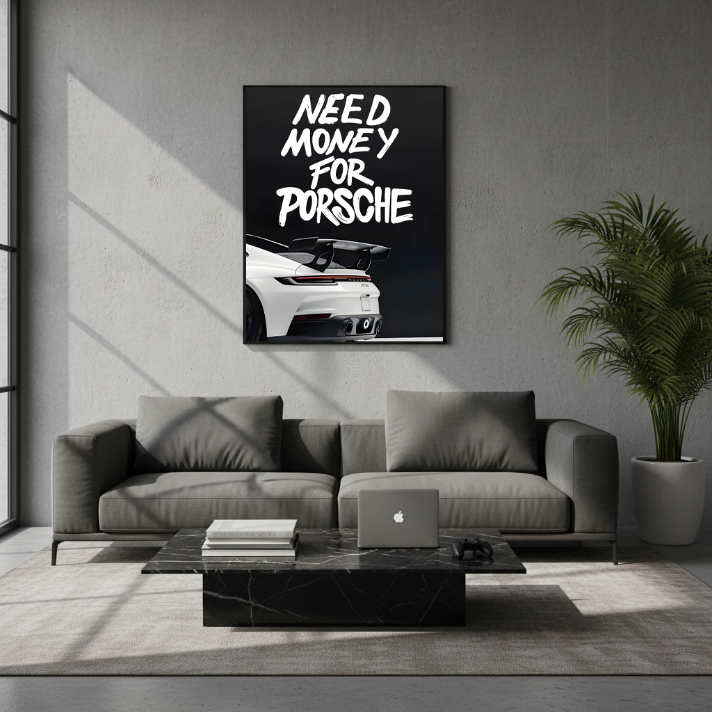 Need Money for Porsche framed poster displayed above a gray sofa in a modern living room with natural light and minimalist decor.