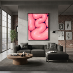 Brain Melt framed wall art displayed above a gray sectional in a modern living room with industrial decor and large windows.