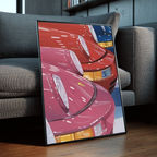 Colored Porsche framed poster leaning against a gray sofa in a modern interior with wood floors, bookshelves, and contemporary decor.