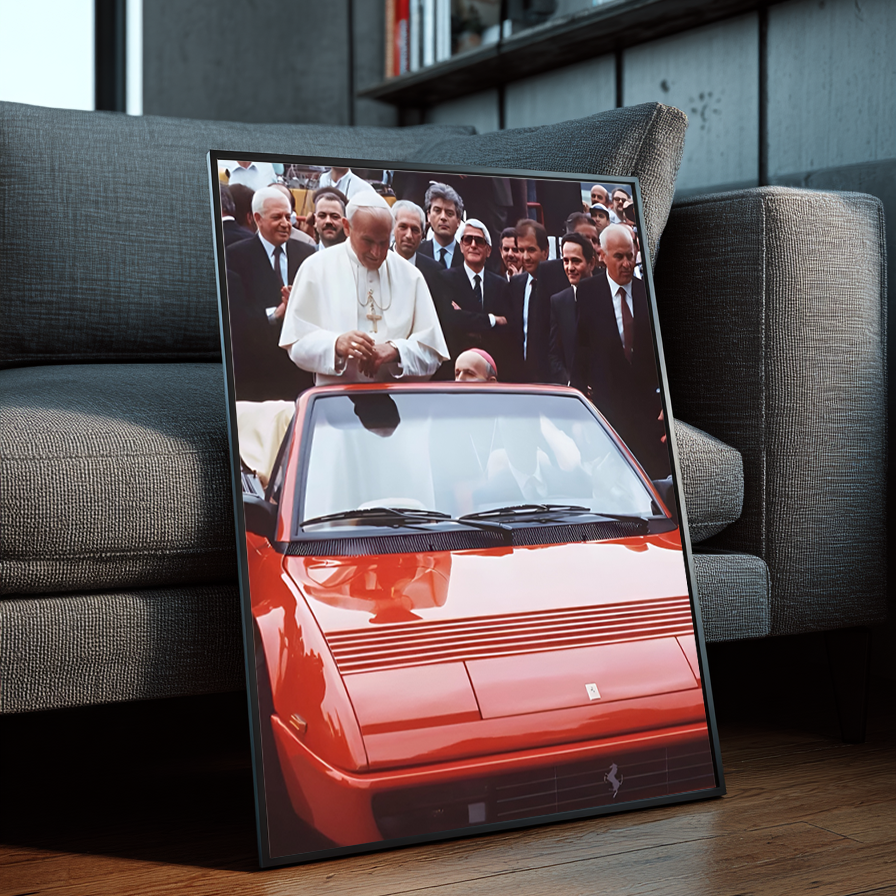 The Pope framed wall art leaning against a gray sofa in a modern interior with wood floors and bookshelves.