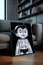 X-Rayed Astro framed poster leaning against a gray sofa in a modern interior with wood floors, bookshelves, and contemporary decor.